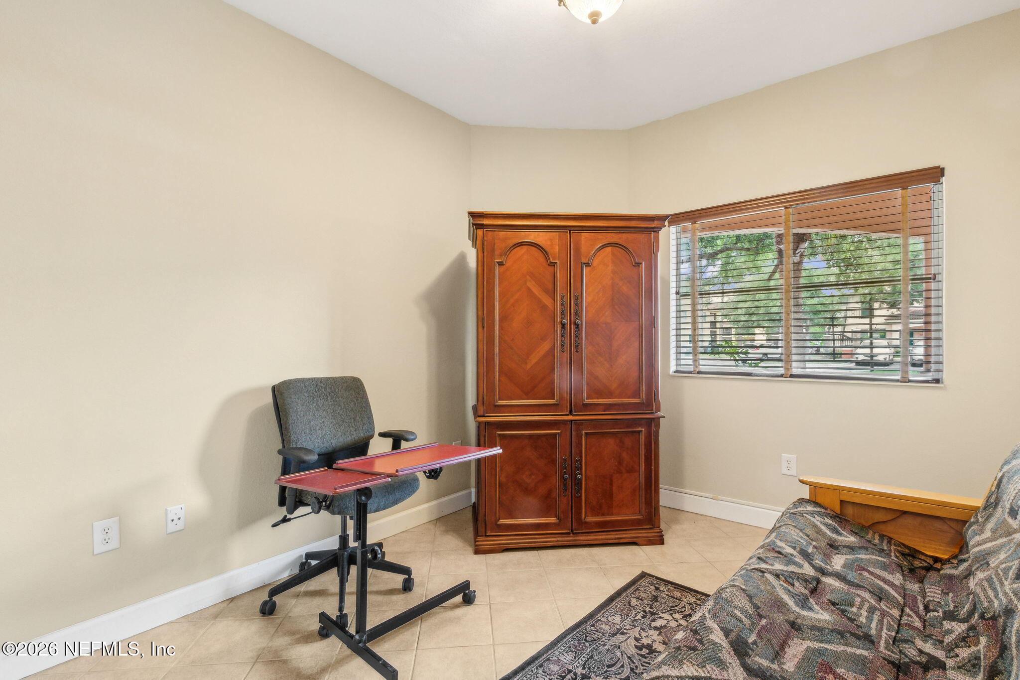 9745 Touchton Road, Unit 1205 Jacksonville, FL 32246 - Photo 15 of 20 a bedroom with furniture and a window