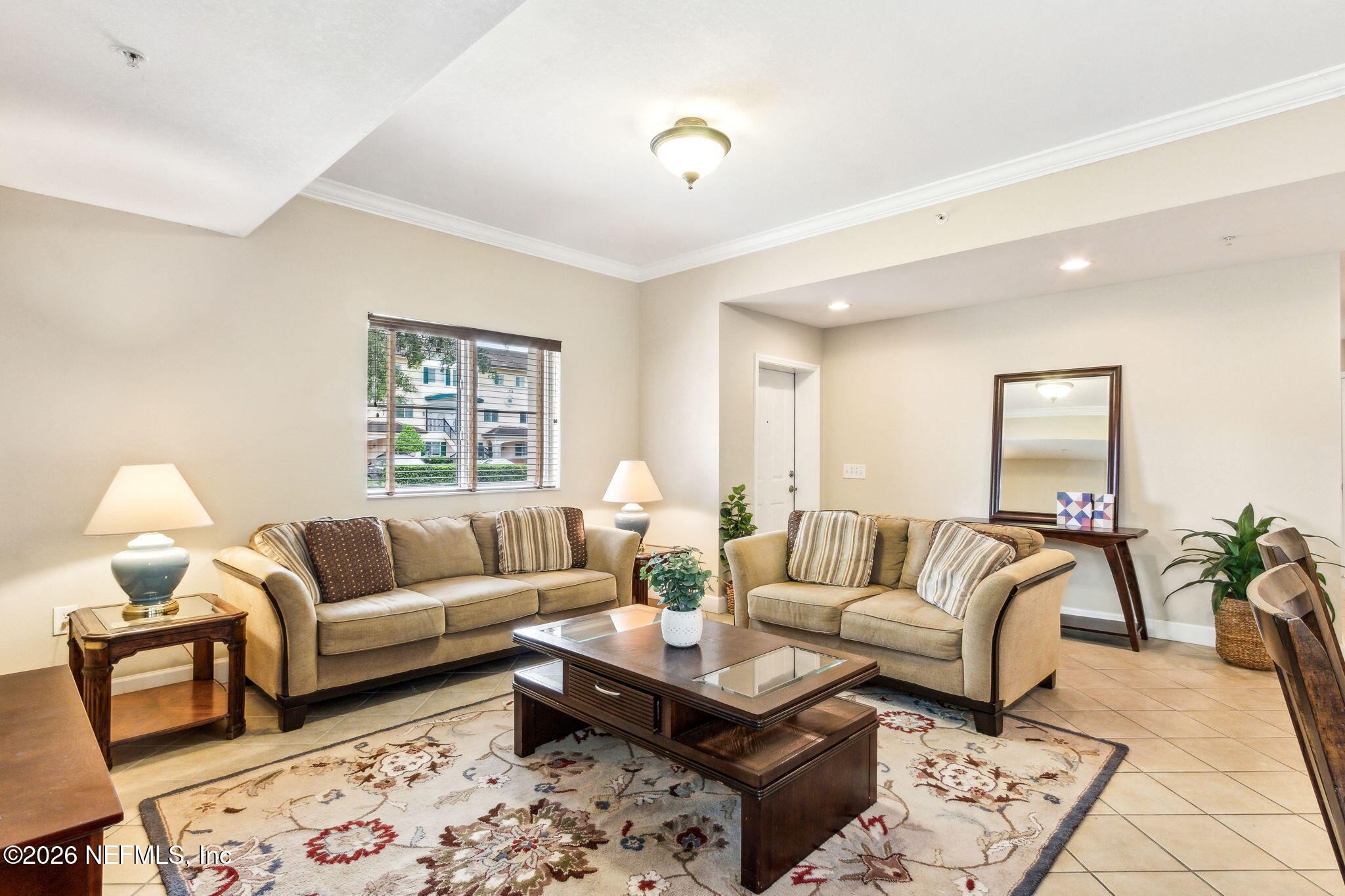 9745 Touchton Road, Unit 1205 Jacksonville, FL 32246 - Photo 3 of 20 a living room with furniture and painting on the wall