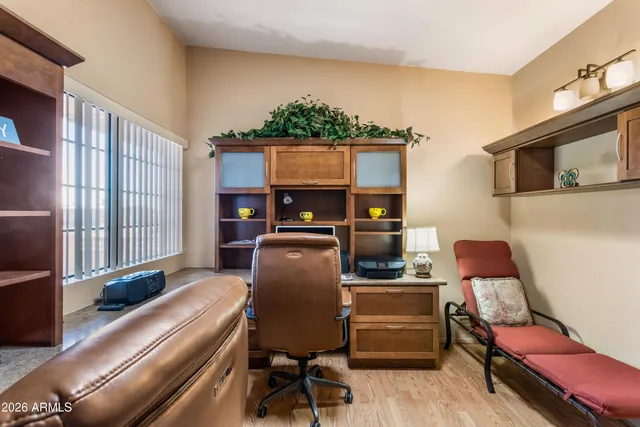 a workspace with furniture and window