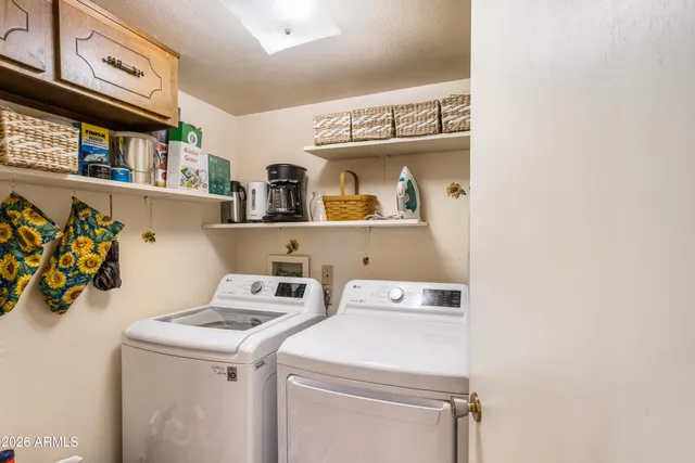 a utility room with dryer and washer