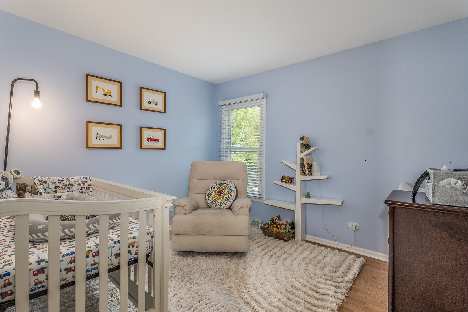 1617 Orth Drive Wheaton, IL 60189 - Photo 14 of 35 a bedroom with a bed and wooden floor