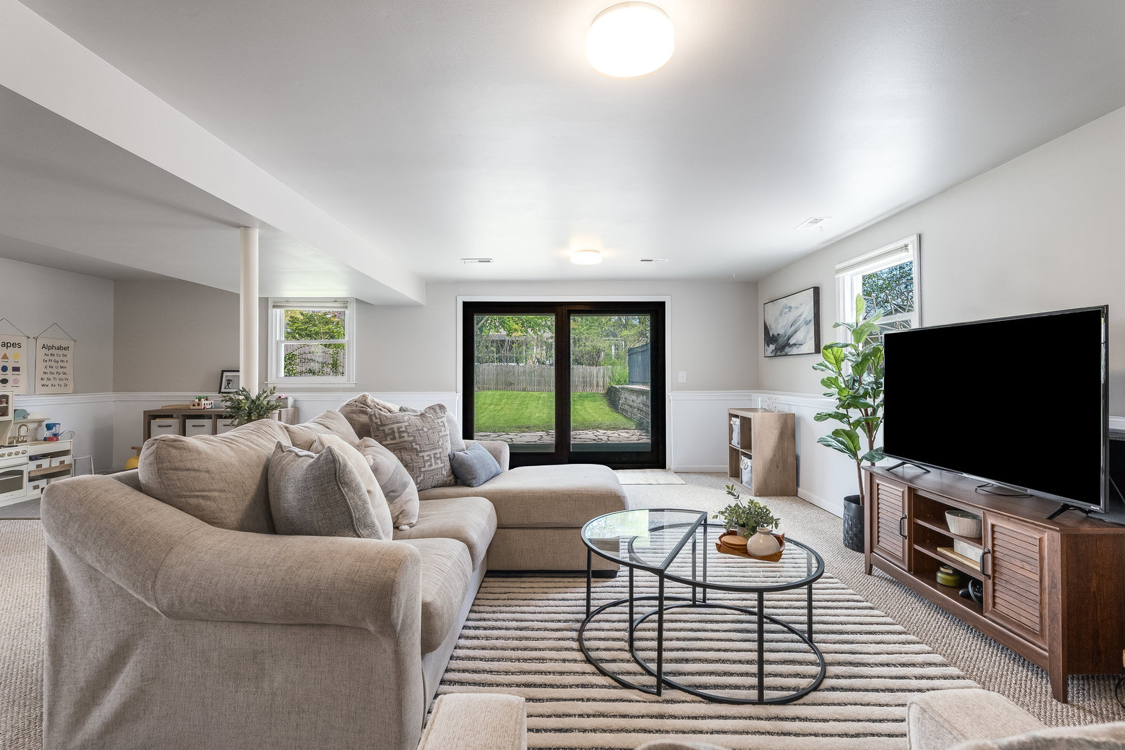 1617 Orth Drive Wheaton, IL 60189 - Photo 16 of 35 a living room with furniture and a flat screen tv
