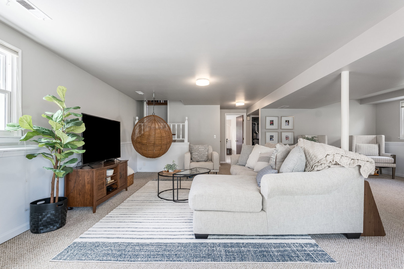 1617 Orth Drive Wheaton, IL 60189 - Photo 17 of 35 a living room with furniture a chandelier and a rug