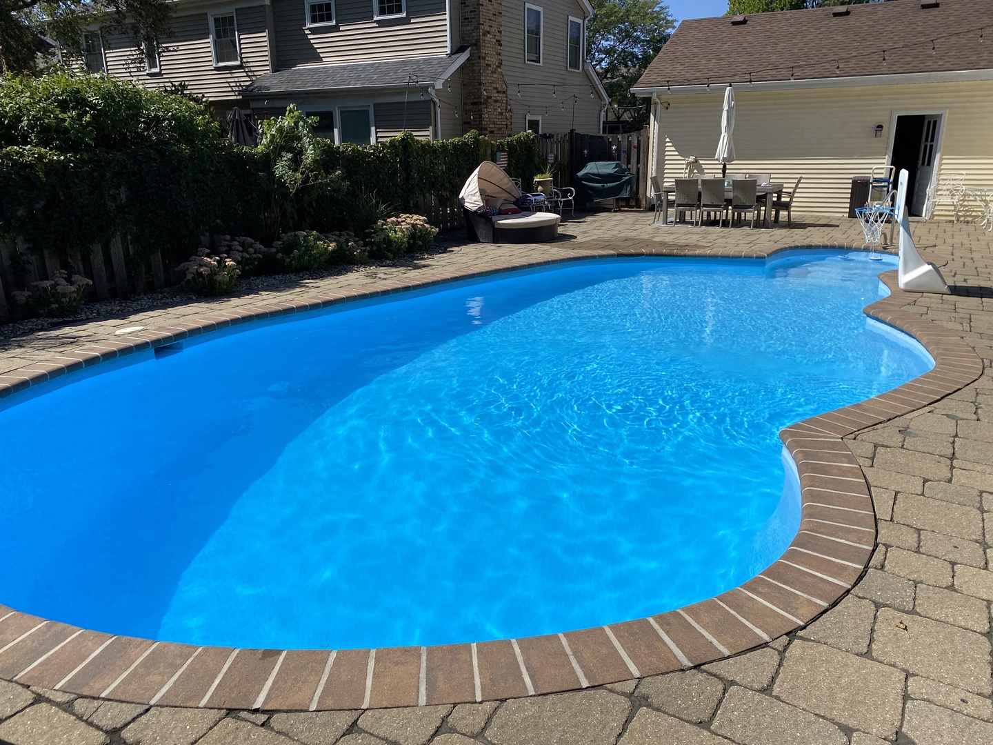1617 Orth Drive Wheaton, IL 60189 - Photo 28 of 35 a view of a swimming pool with seating area