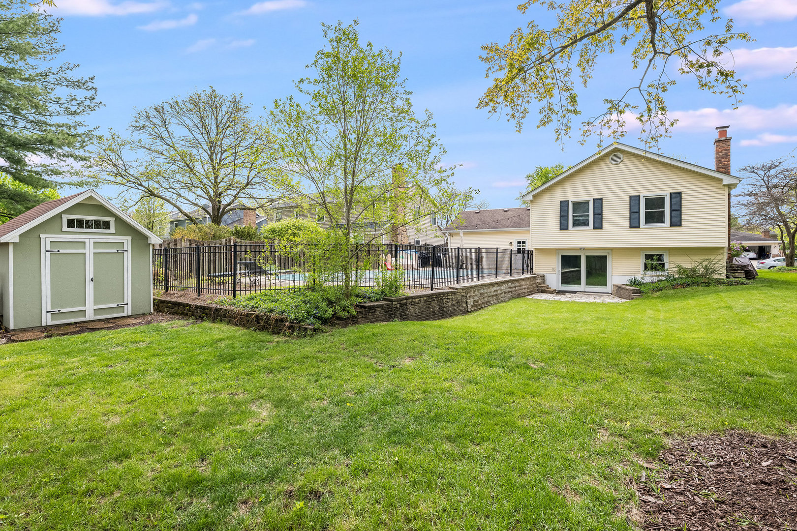 1617 Orth Drive Wheaton, IL 60189 - Photo 29 of 35 a view of a house with a big yard and large trees
