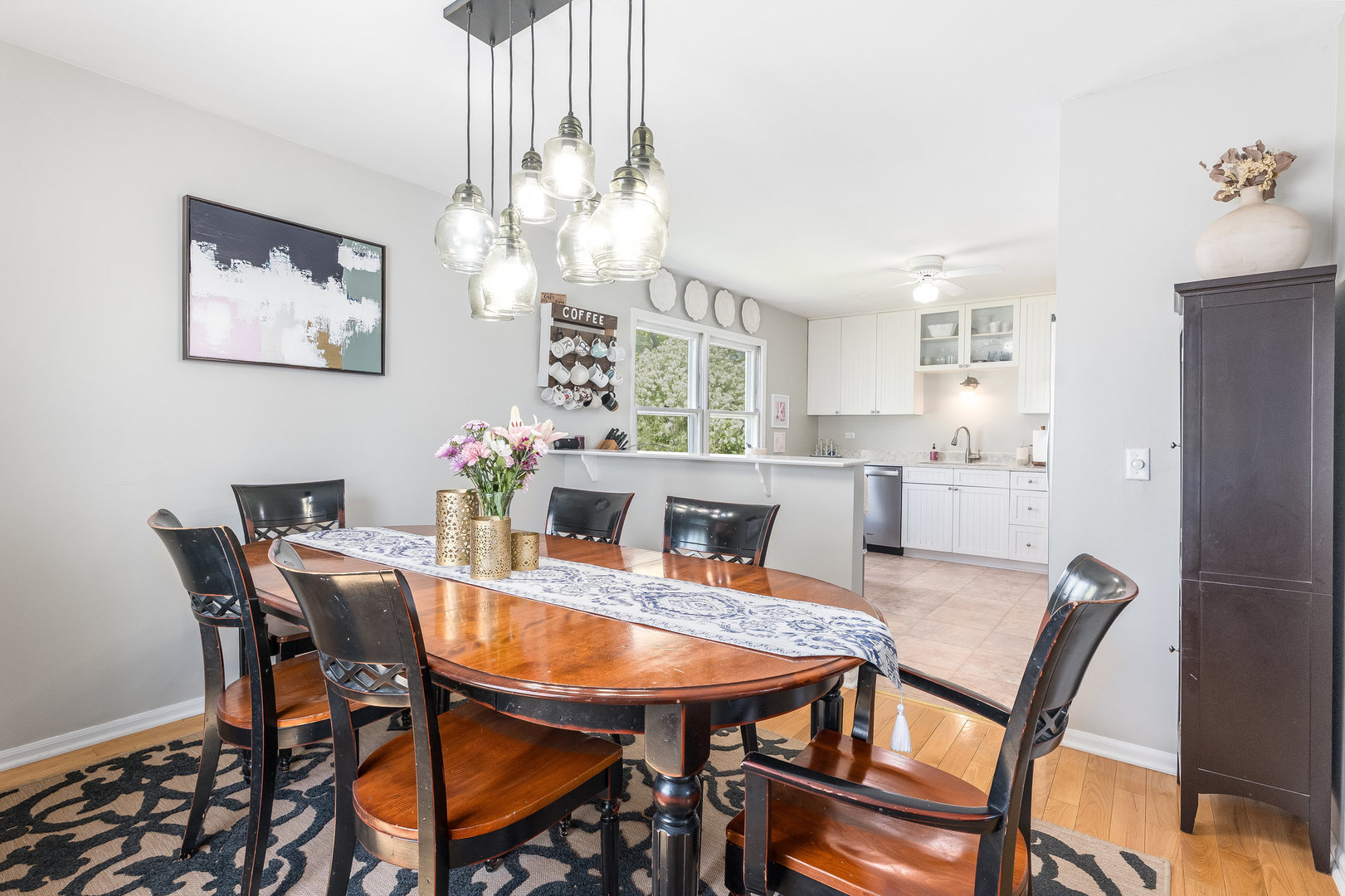 1617 Orth Drive Wheaton, IL 60189 - Photo 6 of 35 a view of a dining room with furniture and a chandelier