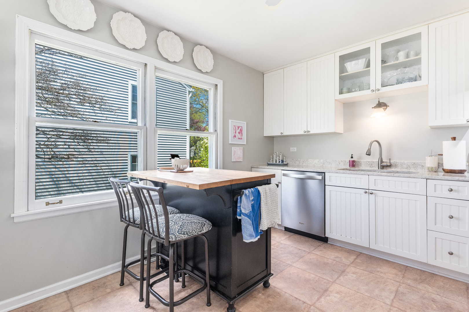 1617 Orth Drive Wheaton, IL 60189 - Photo 7 of 35 a kitchen with stainless steel appliances granite countertop a stove a sink dishwasher and a microwave oven with cabinets