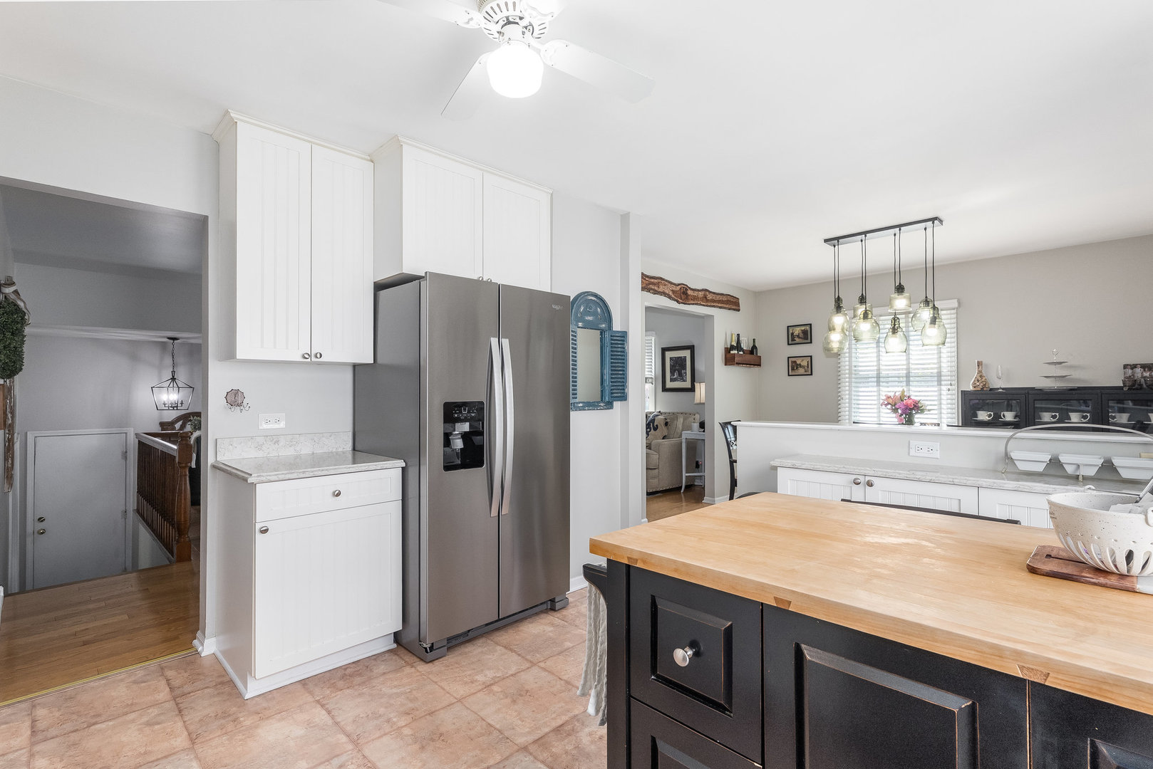 1617 Orth Drive Wheaton, IL 60189 - Photo 8 of 35 a kitchen with stainless steel appliances granite countertop a kitchen island a refrigerator a stove and a sink