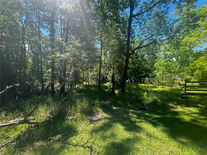 a view of a lake with a yard
