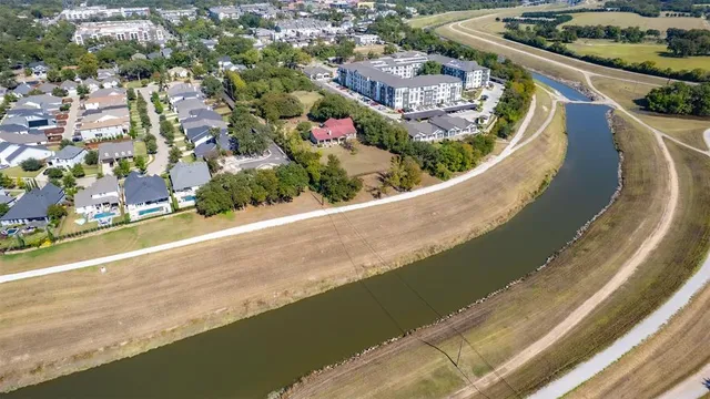 a view of a swimming pool with a outdoor seating