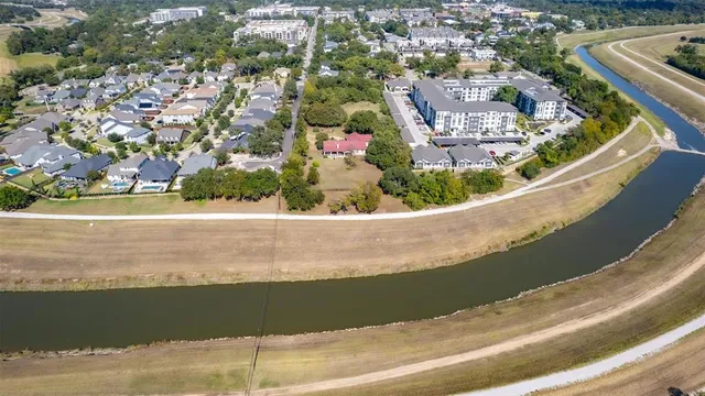 an aerial view of a house with a lake view
