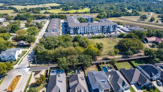 an aerial view of residential house with outdoor space and swimming pool