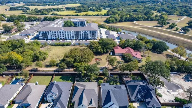 a view of a chairs and table in the backyard