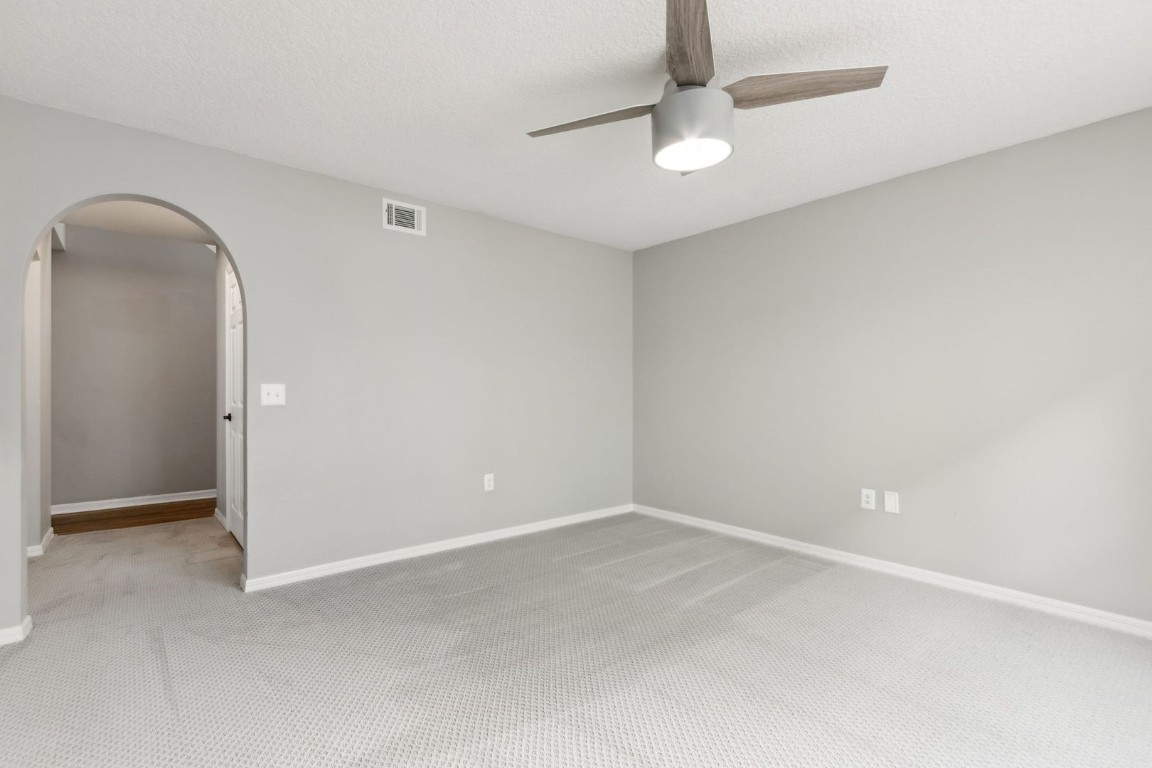 76367 Longleaf Loop Yulee, FL 32097 - Photo 14 of 49 an empty room with a fan
