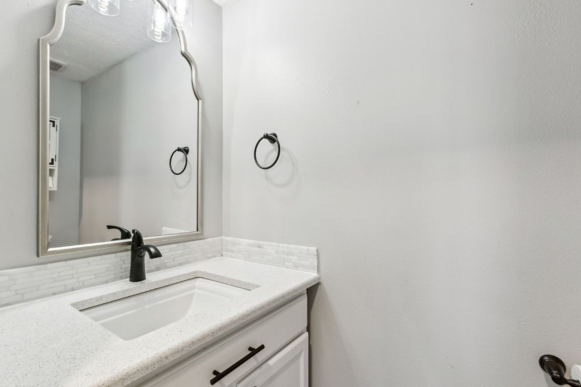 76367 Longleaf Loop Yulee, FL 32097 - Photo 16 of 49 a bathroom with a sink and vanity