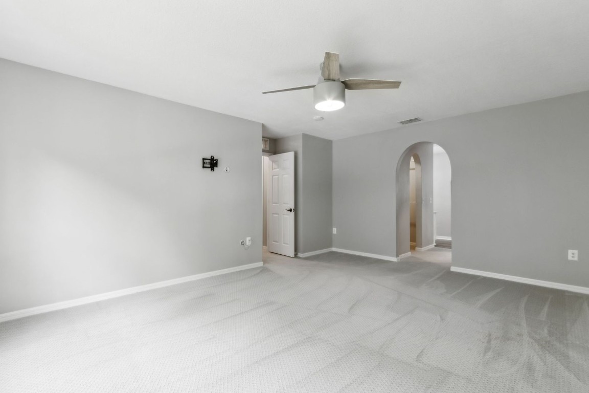76367 Longleaf Loop Yulee, FL 32097 - Photo 17 of 49 an empty room with a ceiling fan and window