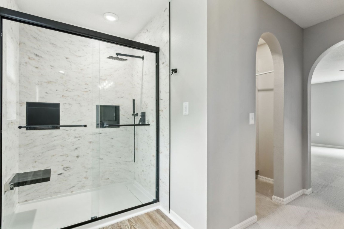 76367 Longleaf Loop Yulee, FL 32097 - Photo 21 of 49 a bathroom with a shower and a mirror