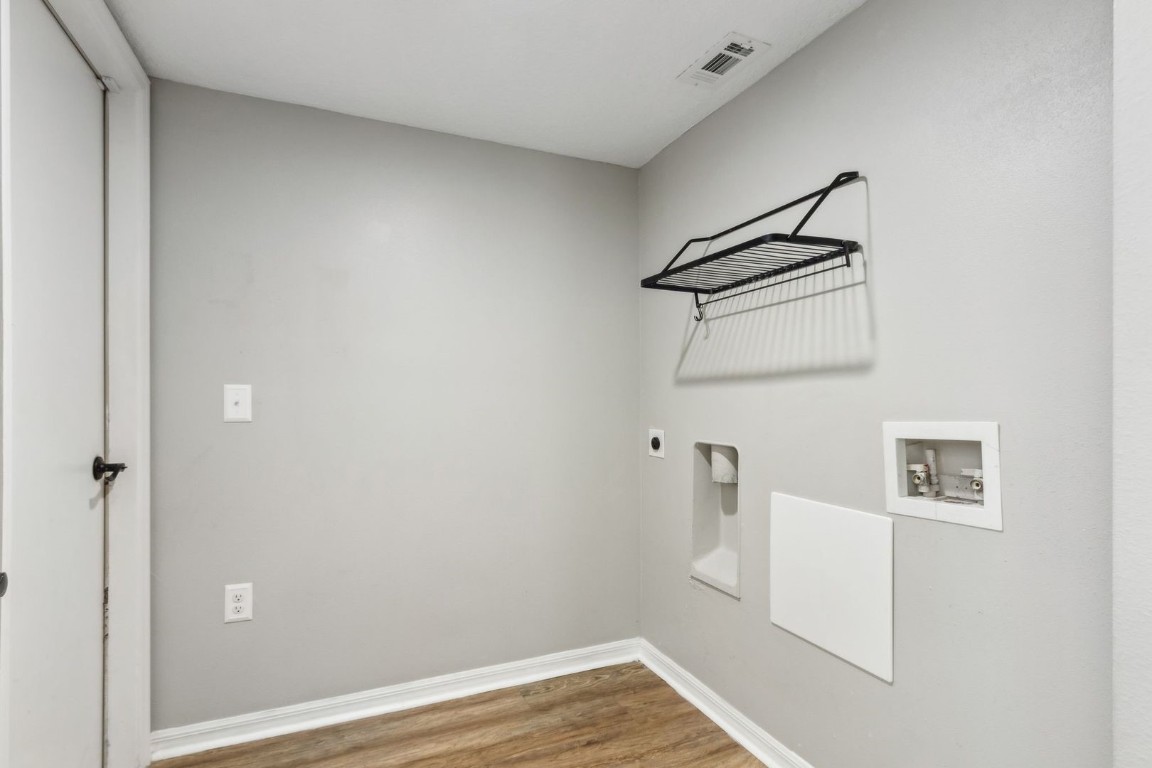 76367 Longleaf Loop Yulee, FL 32097 - Photo 31 of 49 a view of a room with wooden floor and cabinet