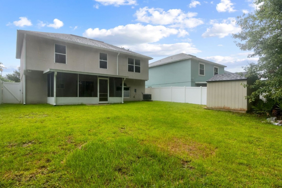 76367 Longleaf Loop Yulee, FL 32097 - Photo 36 of 49 a house view with a garden space
