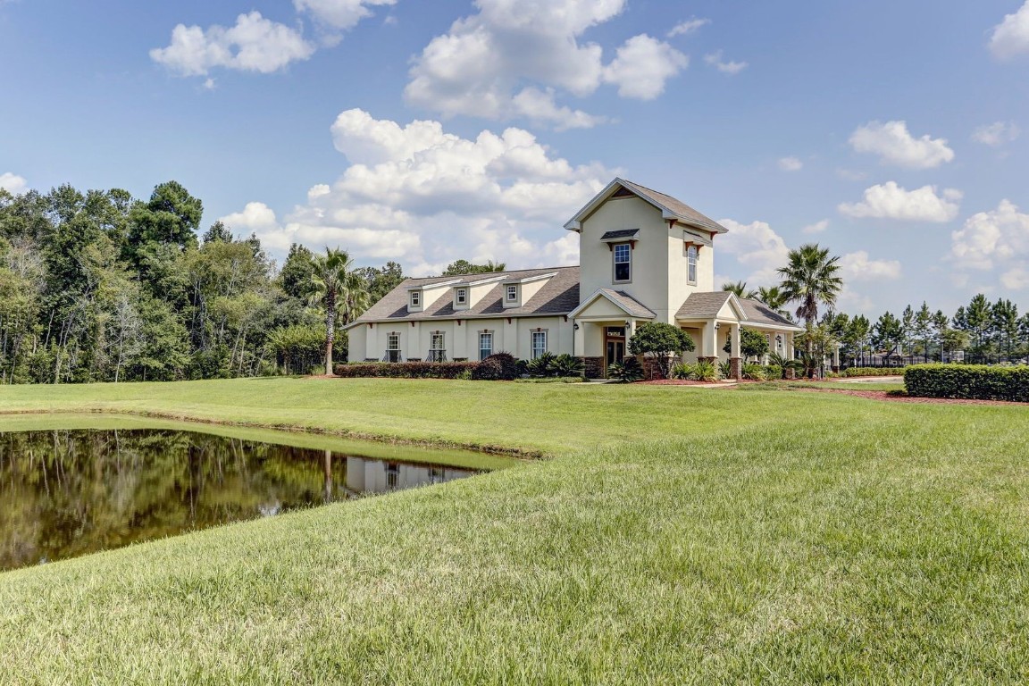 76367 Longleaf Loop Yulee, FL 32097 - Photo 43 of 49 a view of a house with a big yard