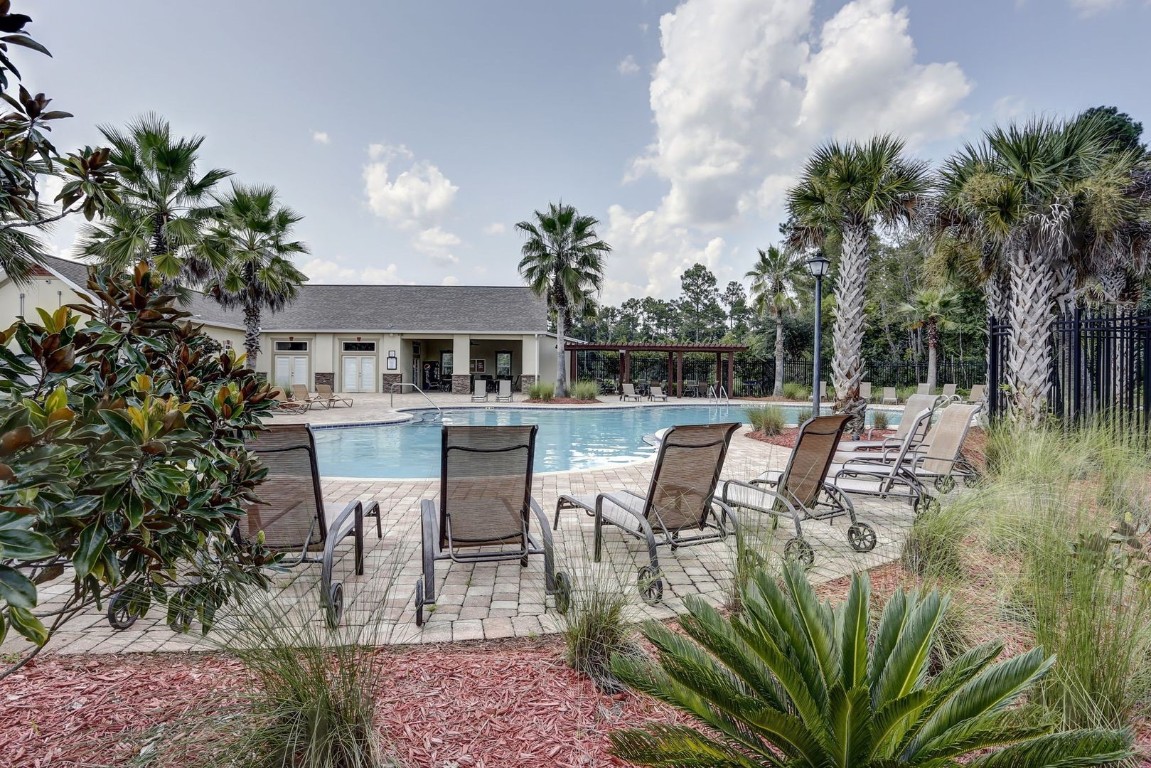 76367 Longleaf Loop Yulee, FL 32097 - Photo 45 of 49 a view of a chairs and table in a patio