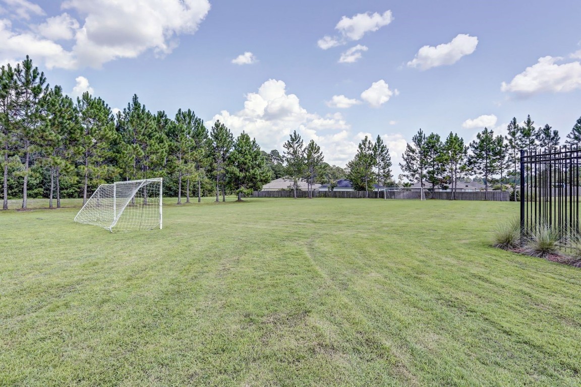 76367 Longleaf Loop Yulee, FL 32097 - Photo 48 of 49 a view of a golf course with a entertaining space