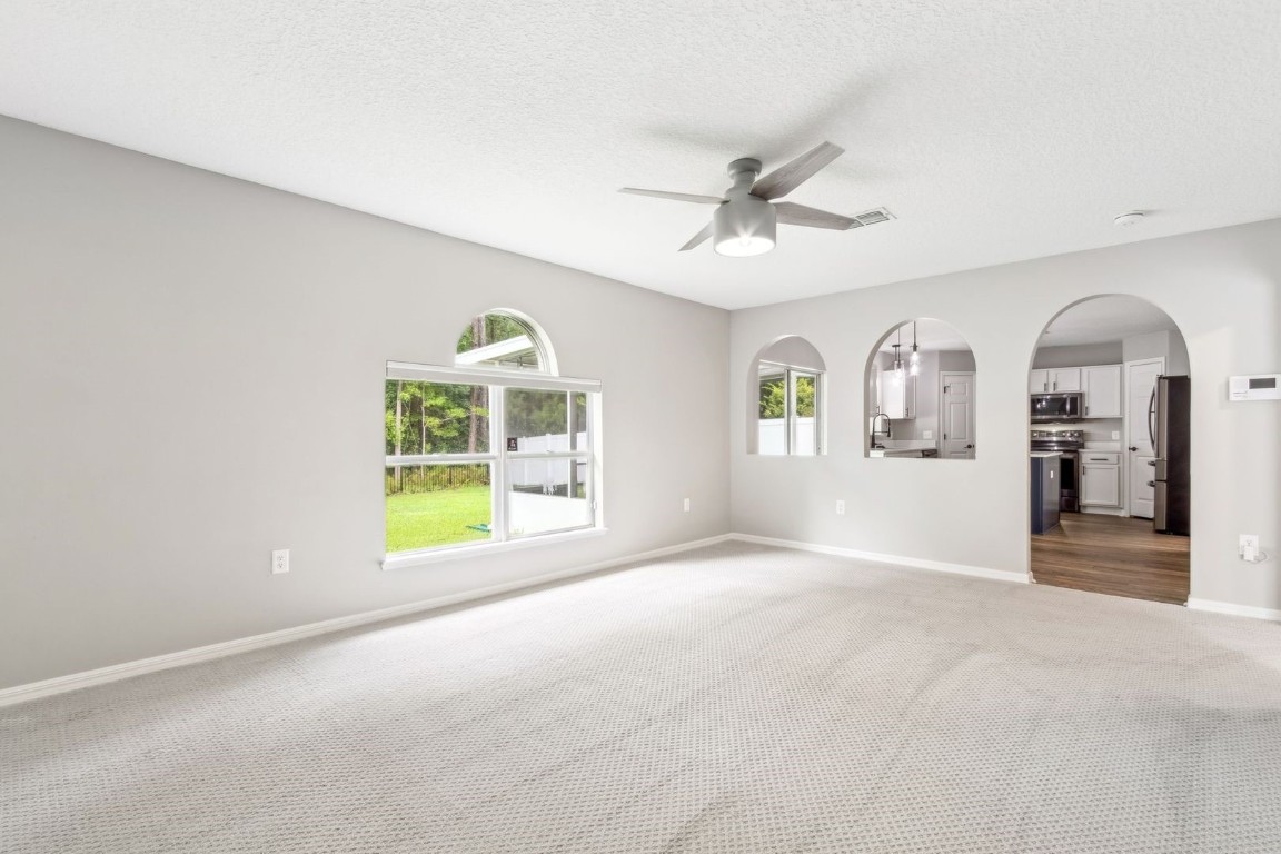 76367 Longleaf Loop Yulee, FL 32097 - Photo 9 of 49 a view of an empty room with a window