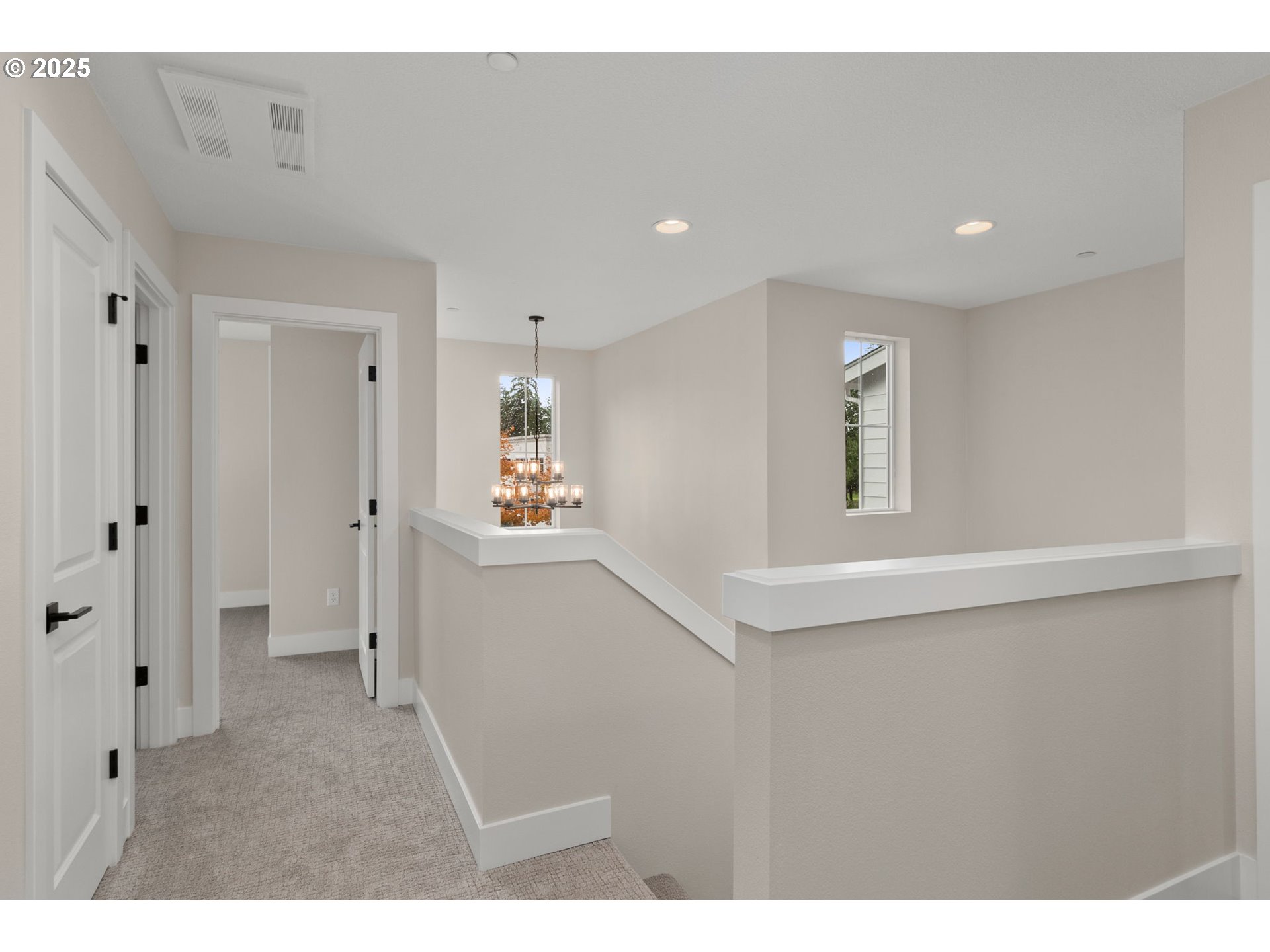 4753 Northwest Camas Meadows Drive Camas, WA 98607 - Photo 18 of 23 a hallway with white doors wooden floor and a window