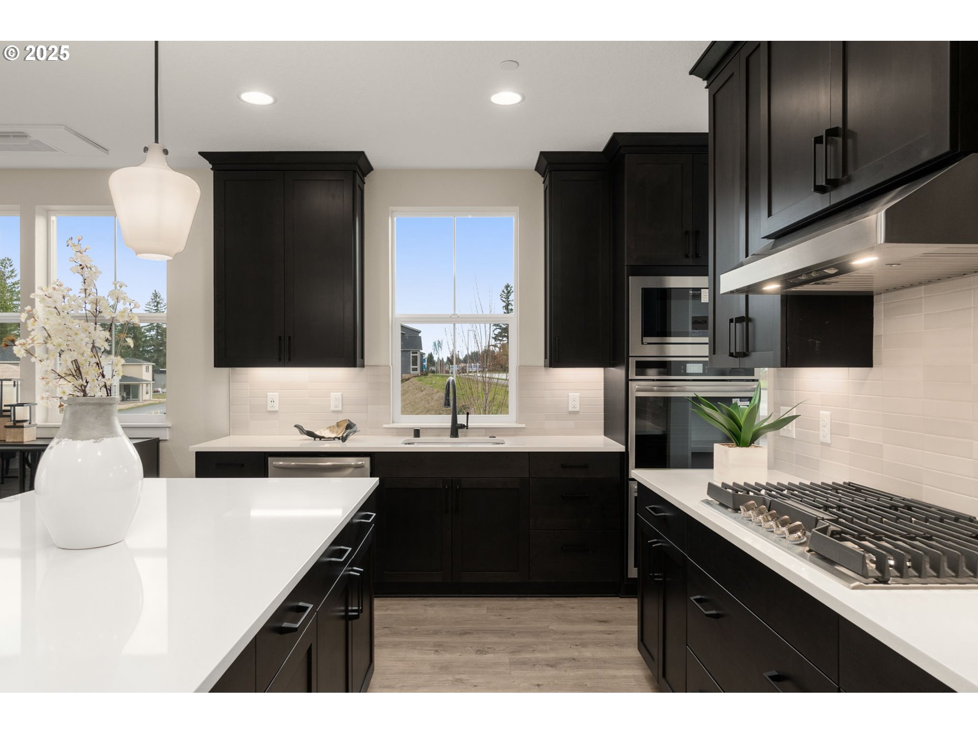 4753 Northwest Camas Meadows Drive Camas, WA 98607 - Photo 8 of 23 a kitchen with a sink stainless steel appliances and cabinets