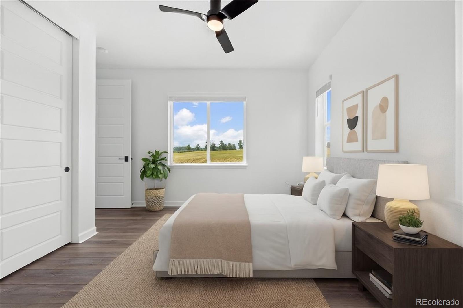 6346 Rockingham Way Castle Pines, CO 80108 - Photo 14 of 43 a bedroom with a bed and wooden floor