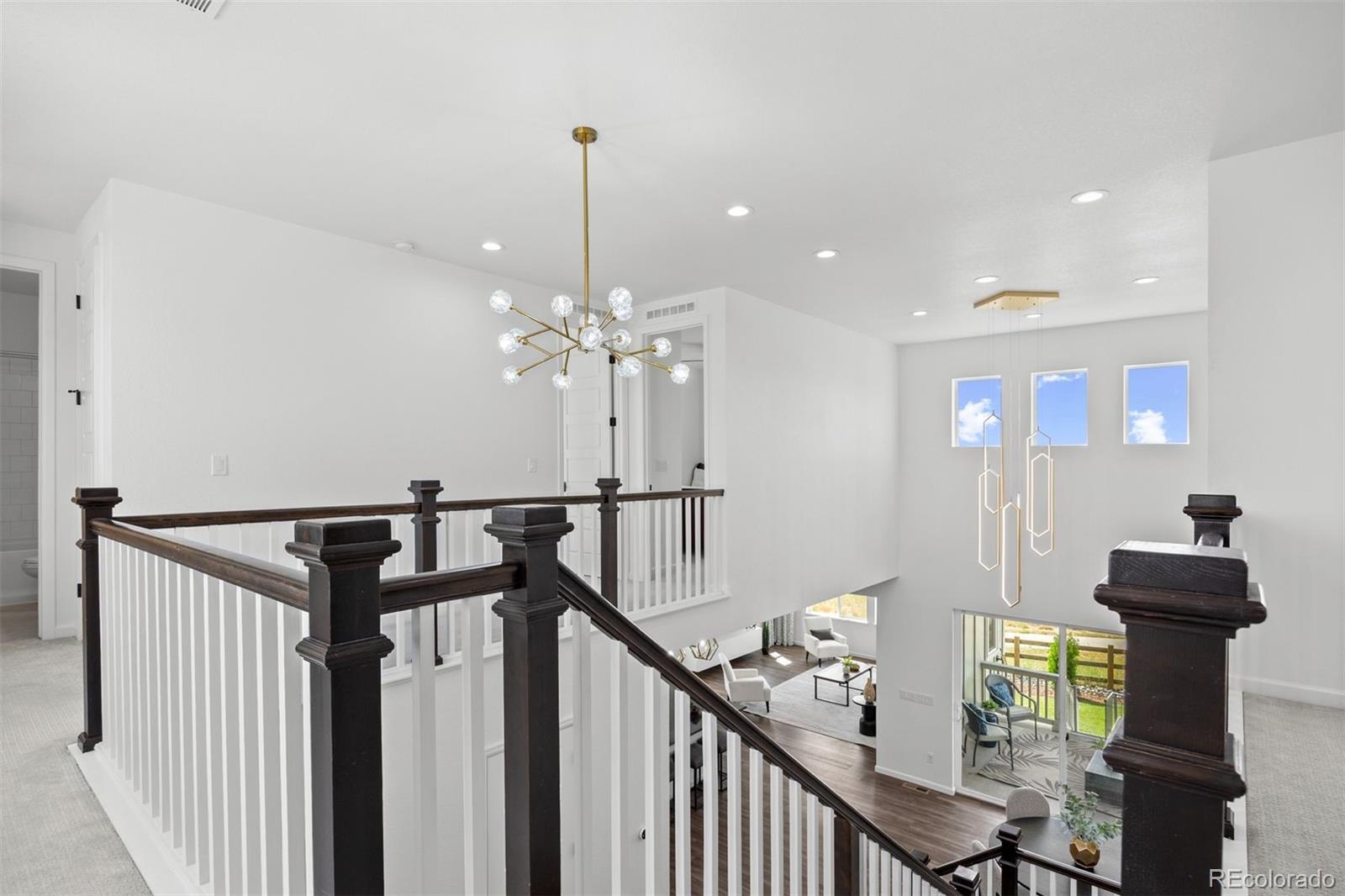 6346 Rockingham Way Castle Pines, CO 80108 - Photo 16 of 43 a view of entryway and hall with wooden floor