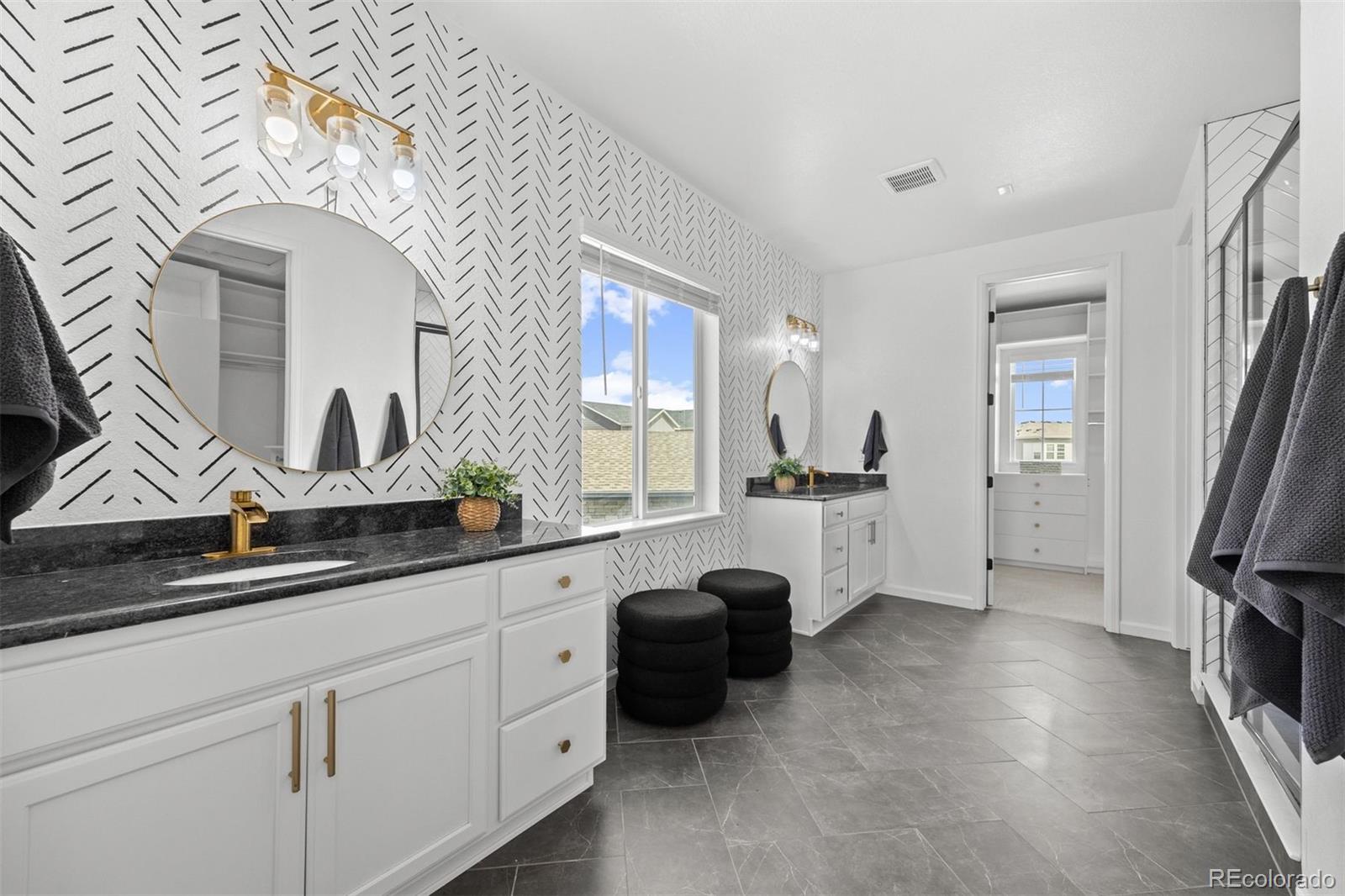 6346 Rockingham Way Castle Pines, CO 80108 - Photo 19 of 43 a kitchen with stainless steel appliances a sink a stove and a refrigerator