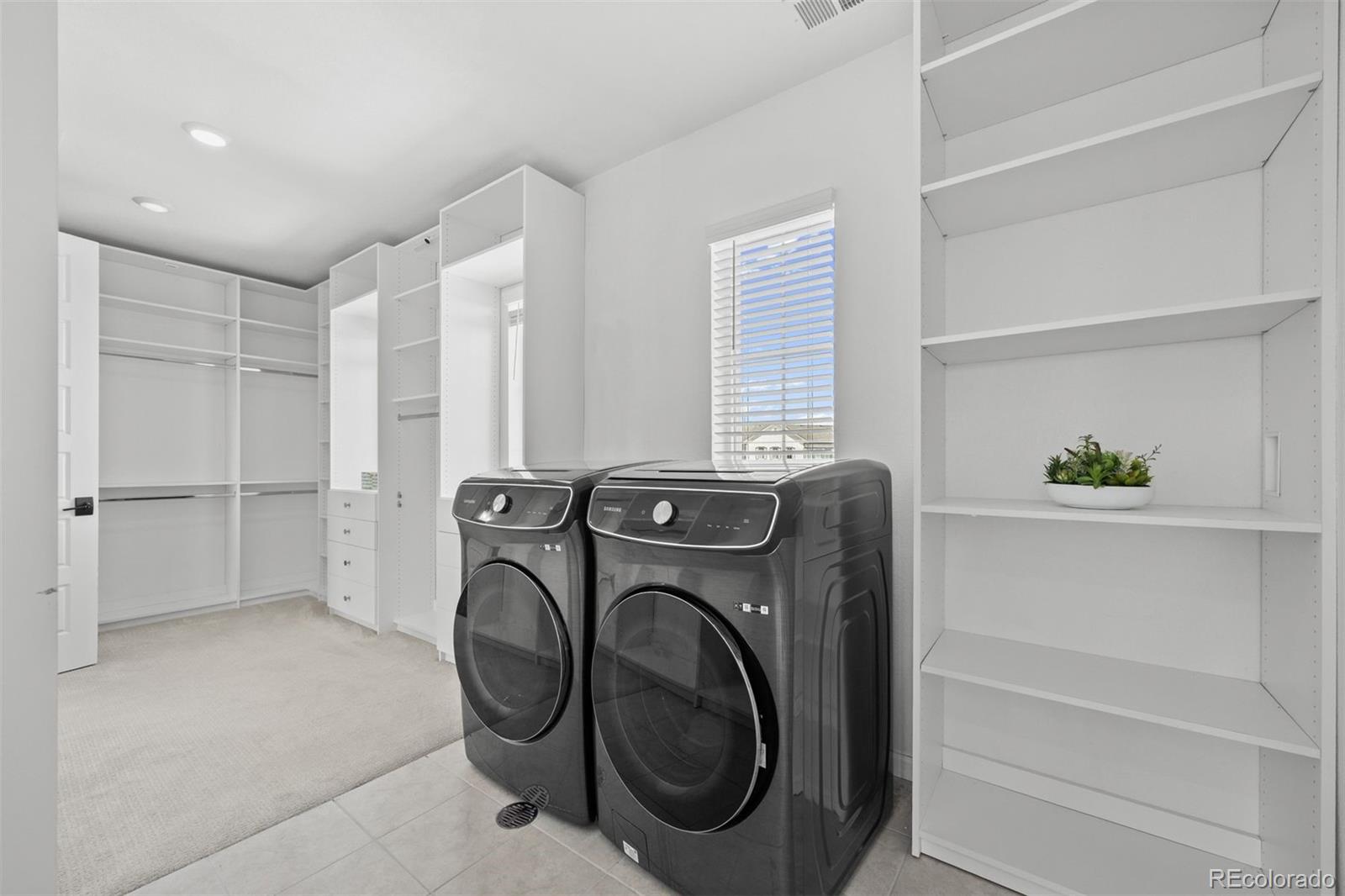 6346 Rockingham Way Castle Pines, CO 80108 - Photo 22 of 43 a utility room with dryer and washer