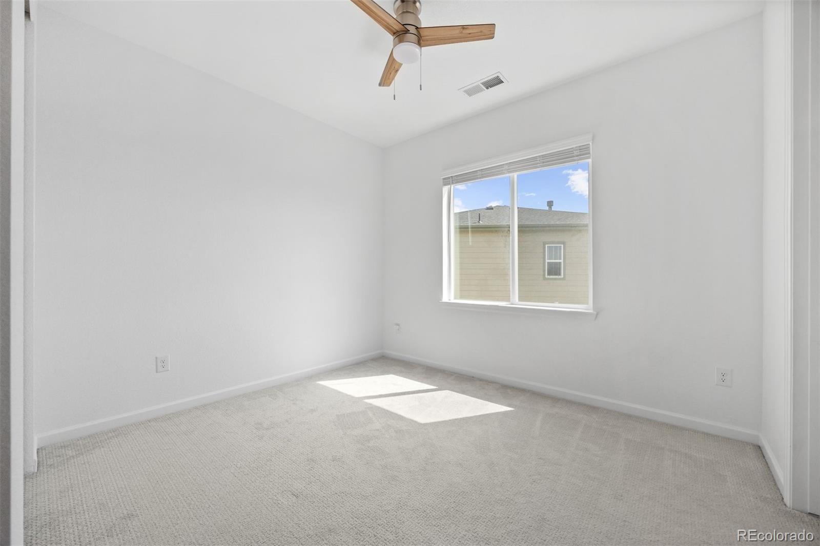 6346 Rockingham Way Castle Pines, CO 80108 - Photo 25 of 43 an empty room with windows