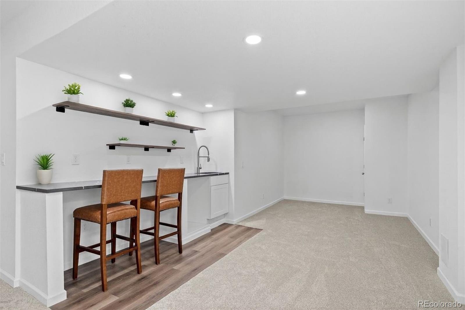 6346 Rockingham Way Castle Pines, CO 80108 - Photo 29 of 43 a view of kitchen with stainless steel appliances furniture refrigerator and dining table