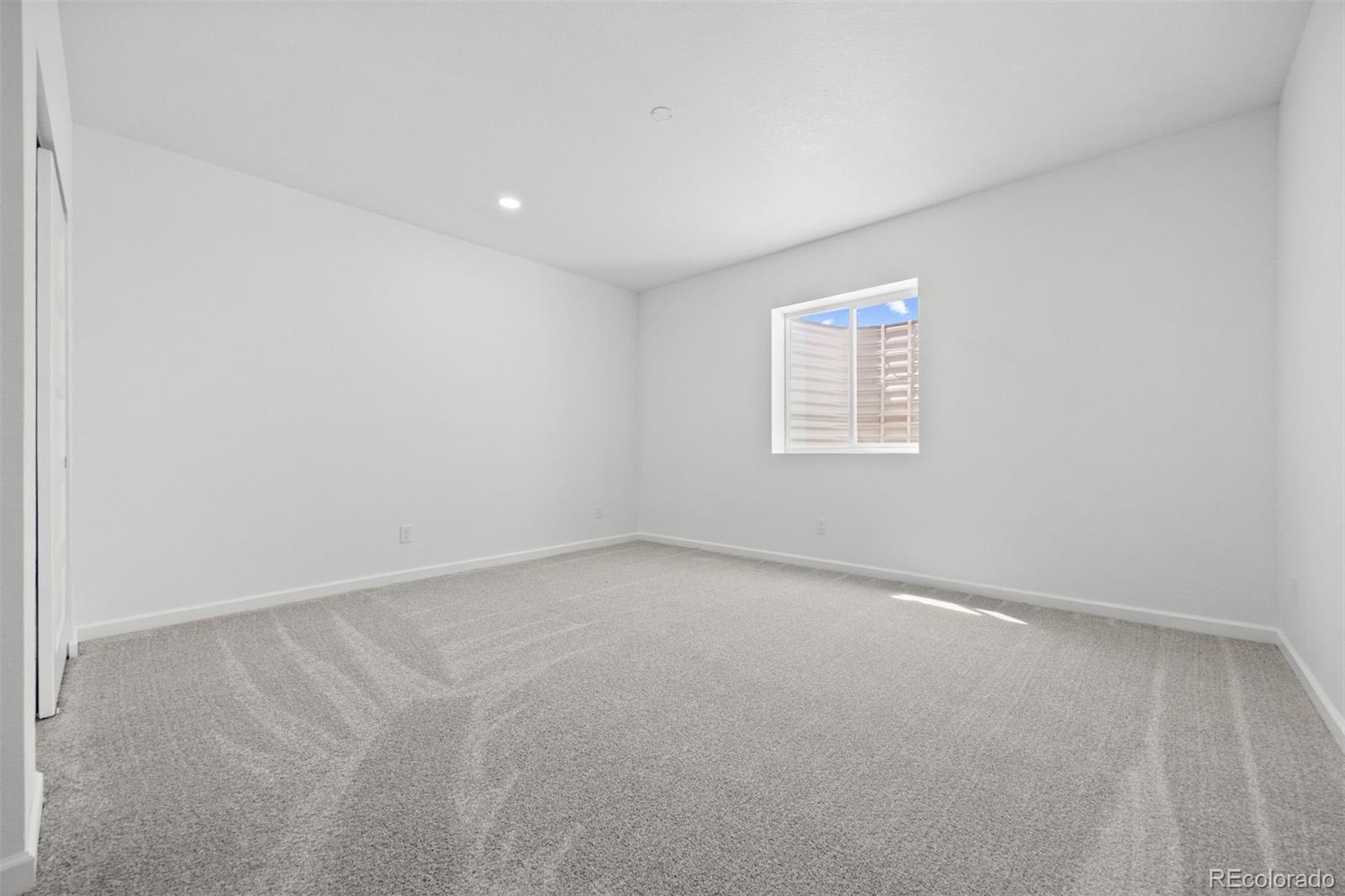 6346 Rockingham Way Castle Pines, CO 80108 - Photo 30 of 43 an empty room with a window