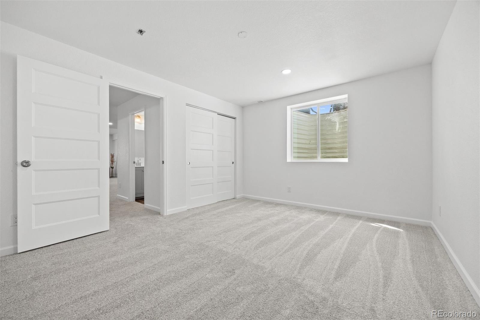 6346 Rockingham Way Castle Pines, CO 80108 - Photo 32 of 43 a view of an empty room with a window