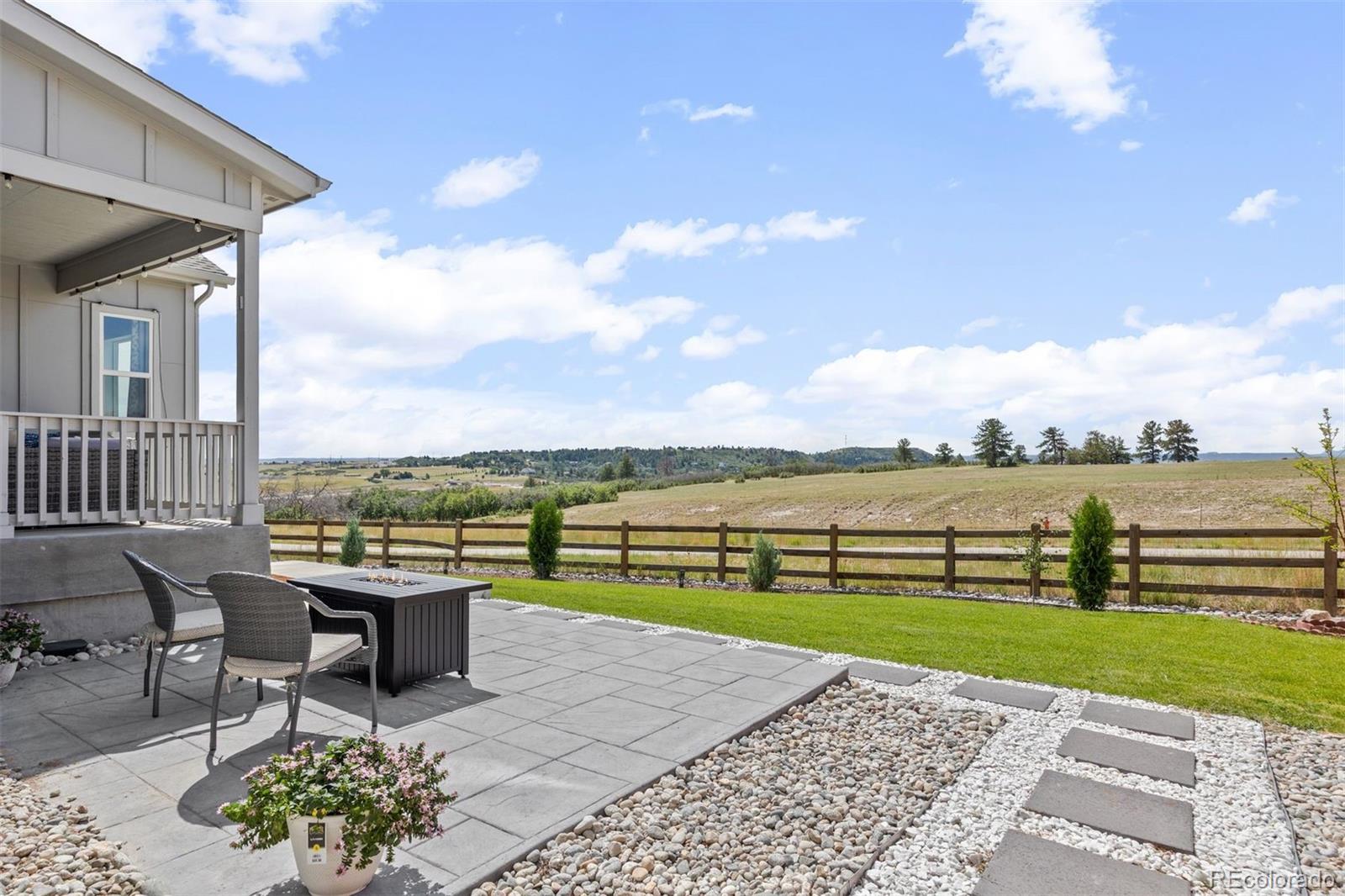 6346 Rockingham Way Castle Pines, CO 80108 - Photo 33 of 43 a view of a terrace with sitting area