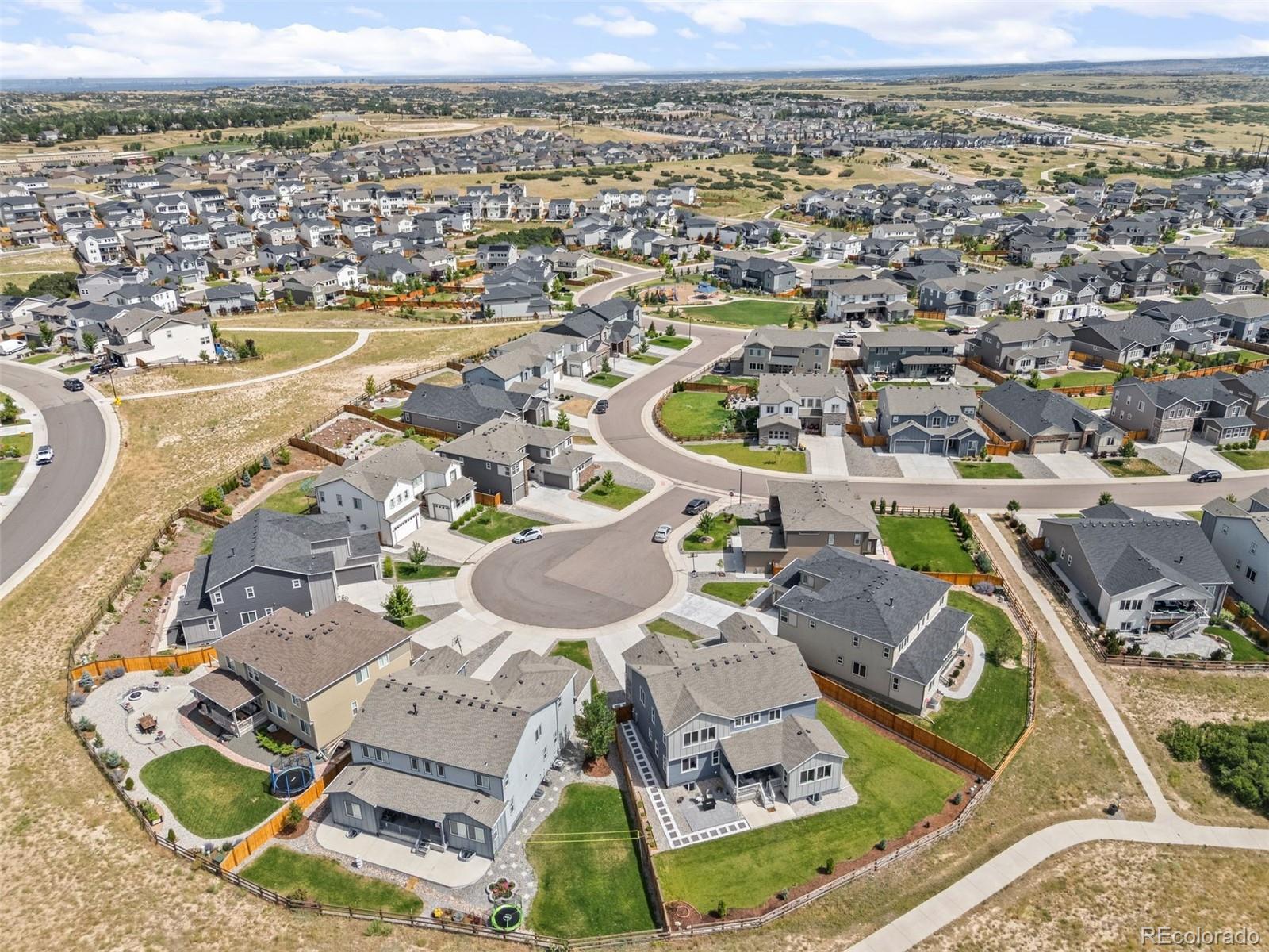 6346 Rockingham Way Castle Pines, CO 80108 - Photo 37 of 43 an aerial view of residential houses with outdoor space