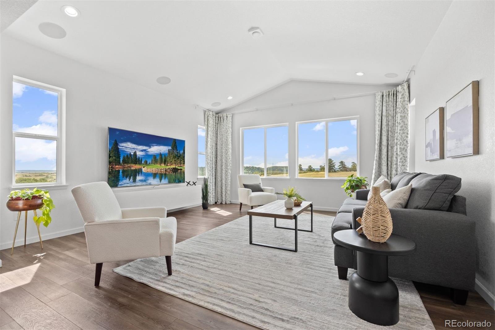 6346 Rockingham Way Castle Pines, CO 80108 - Photo 10 of 43 a living room with furniture and a wooden floor