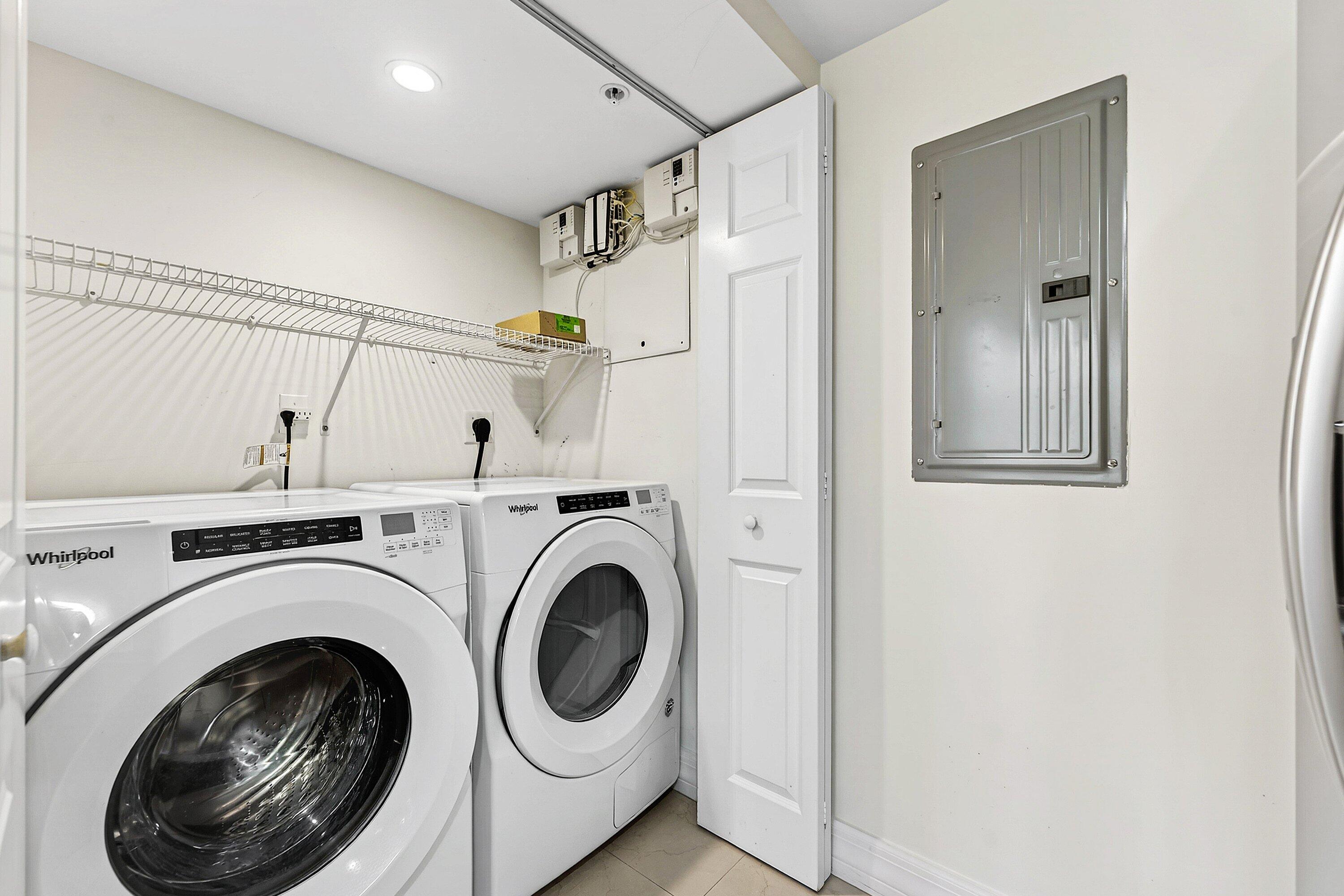 3000 North Ocean Drive, Unit 8F Singer Island, FL 33404 - Photo 13 of 66 a view of a hallway with washer and dryer