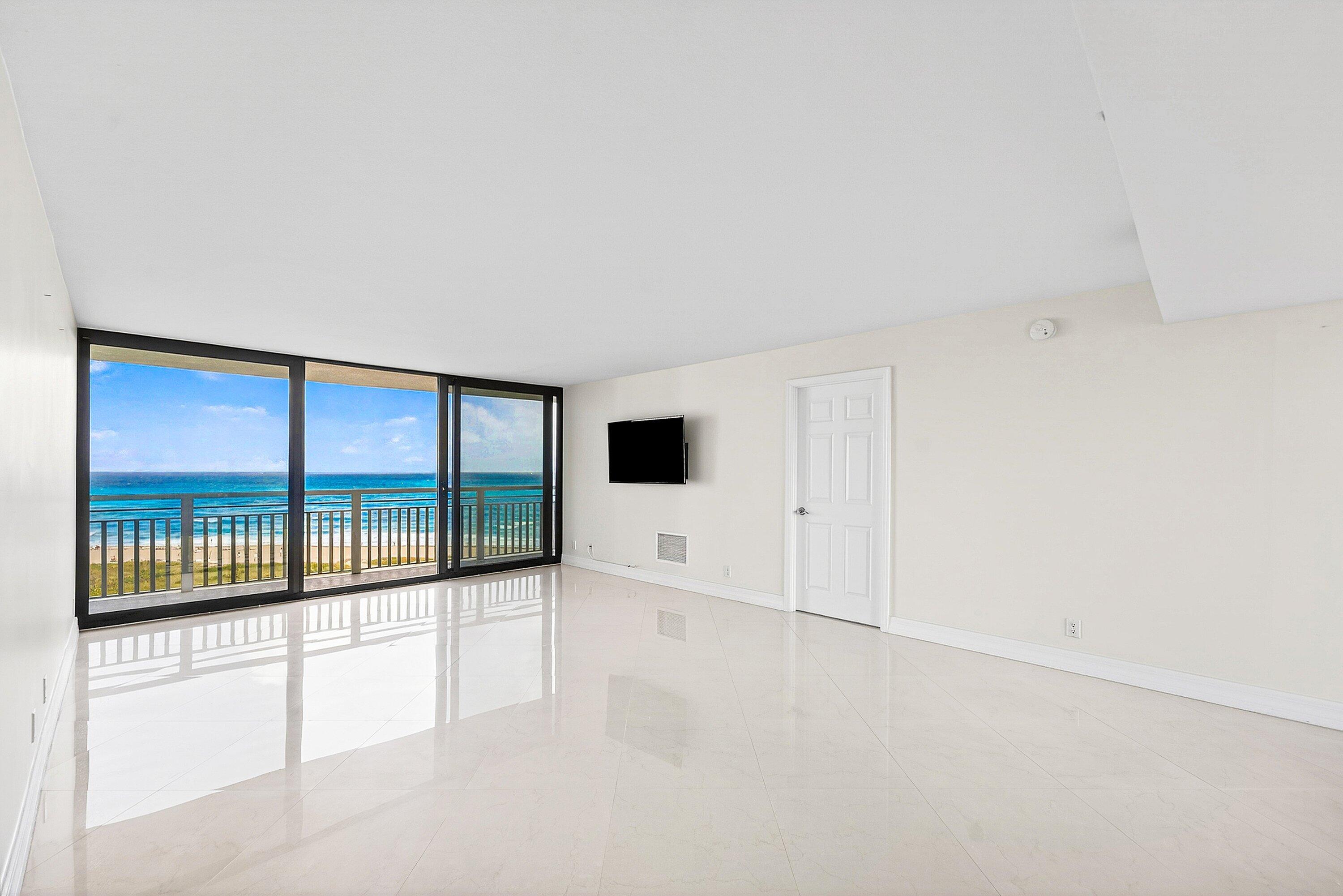 3000 North Ocean Drive, Unit 8F Singer Island, FL 33404 - Photo 26 of 66 a view of an empty room with a floor to ceiling window