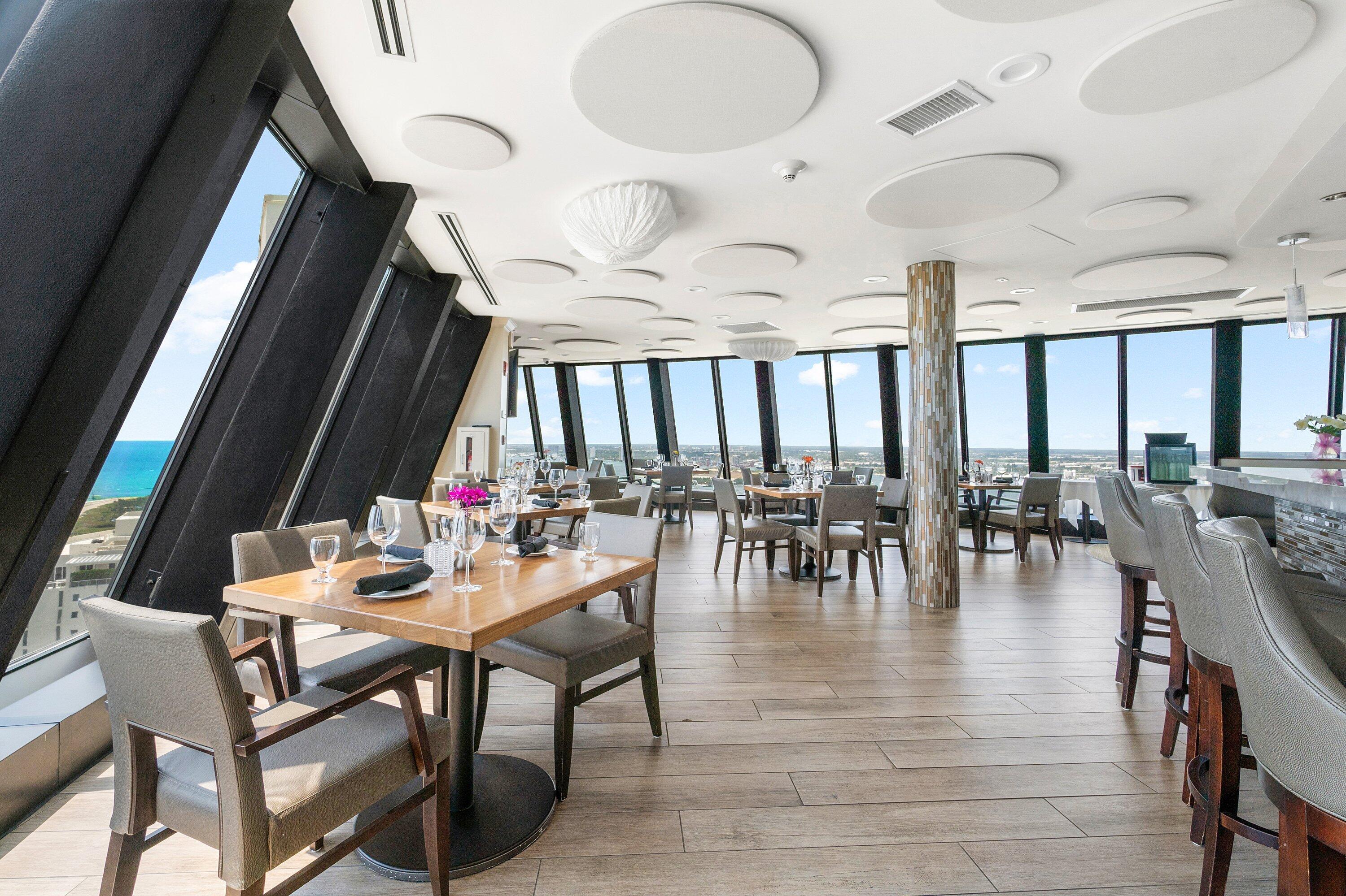 3000 North Ocean Drive, Unit 8F Singer Island, FL 33404 - Photo 50 of 66 an outdoor space with lots of chairs and mirrors