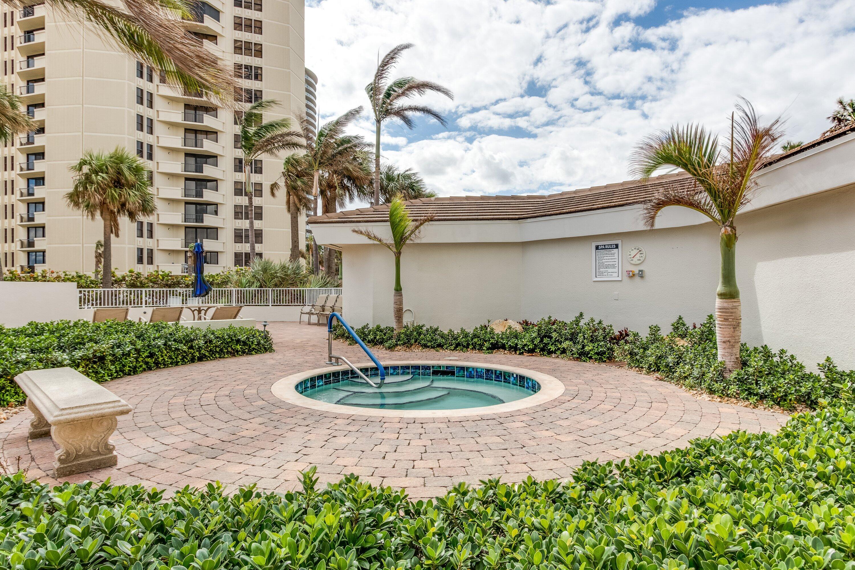 3000 North Ocean Drive, Unit 8F Singer Island, FL 33404 - Photo 64 of 66 a front view of a house with garden
