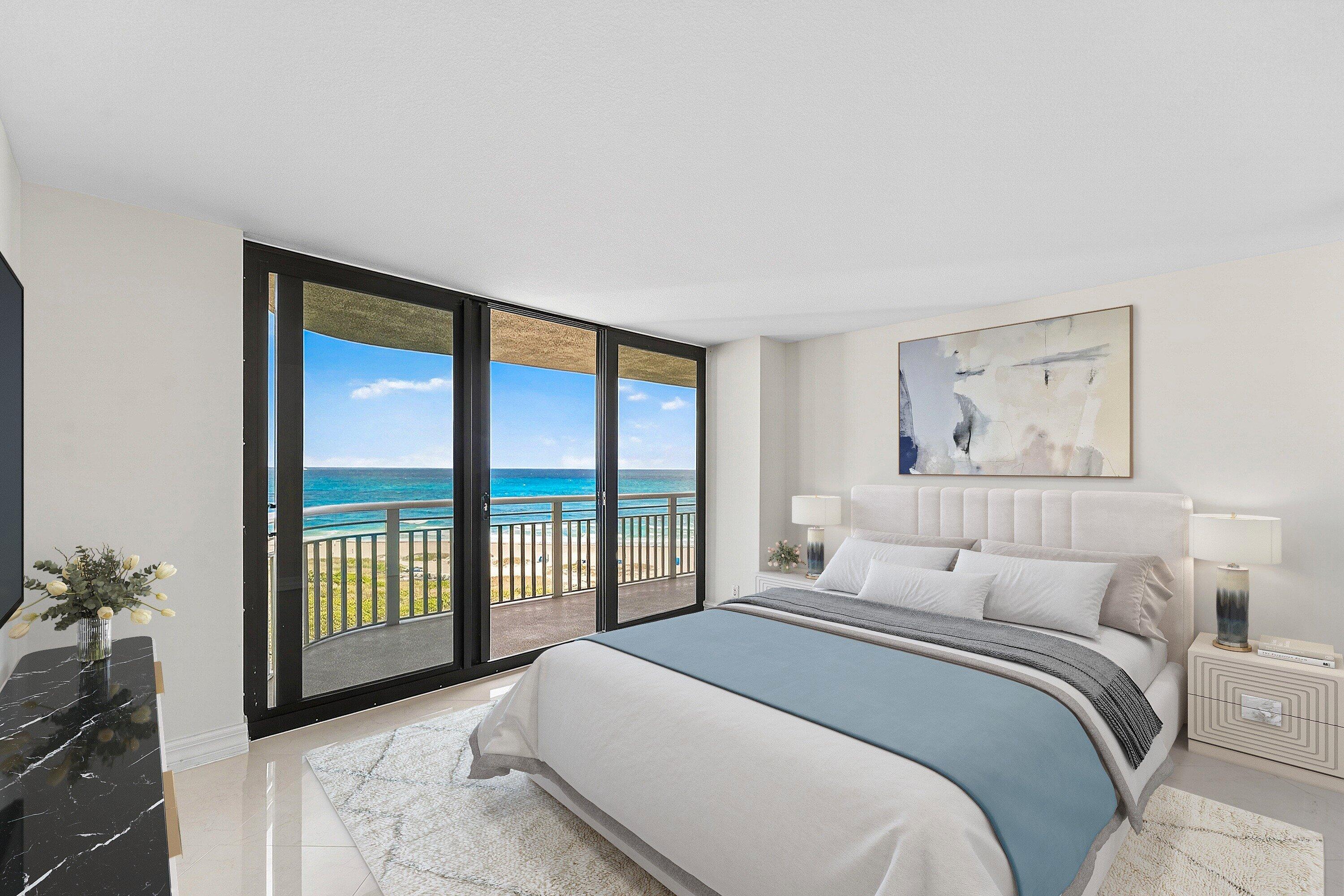 3000 North Ocean Drive, Unit 8F Singer Island, FL 33404 - Photo 8 of 66 a bedroom with a large bed and a large window