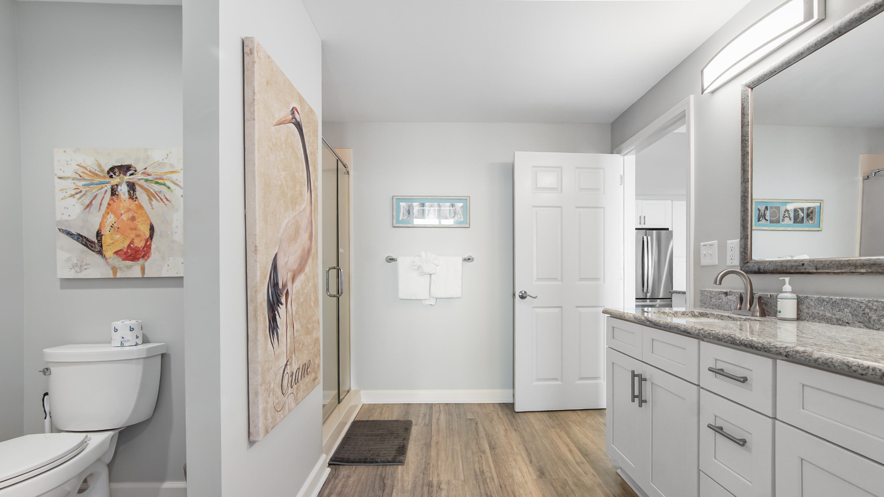 17739 Front Beach Road, Unit 507W Panama City Beach, FL 32413 - Photo 13 of 49 a spacious bathroom with a shower a sink and a toilet