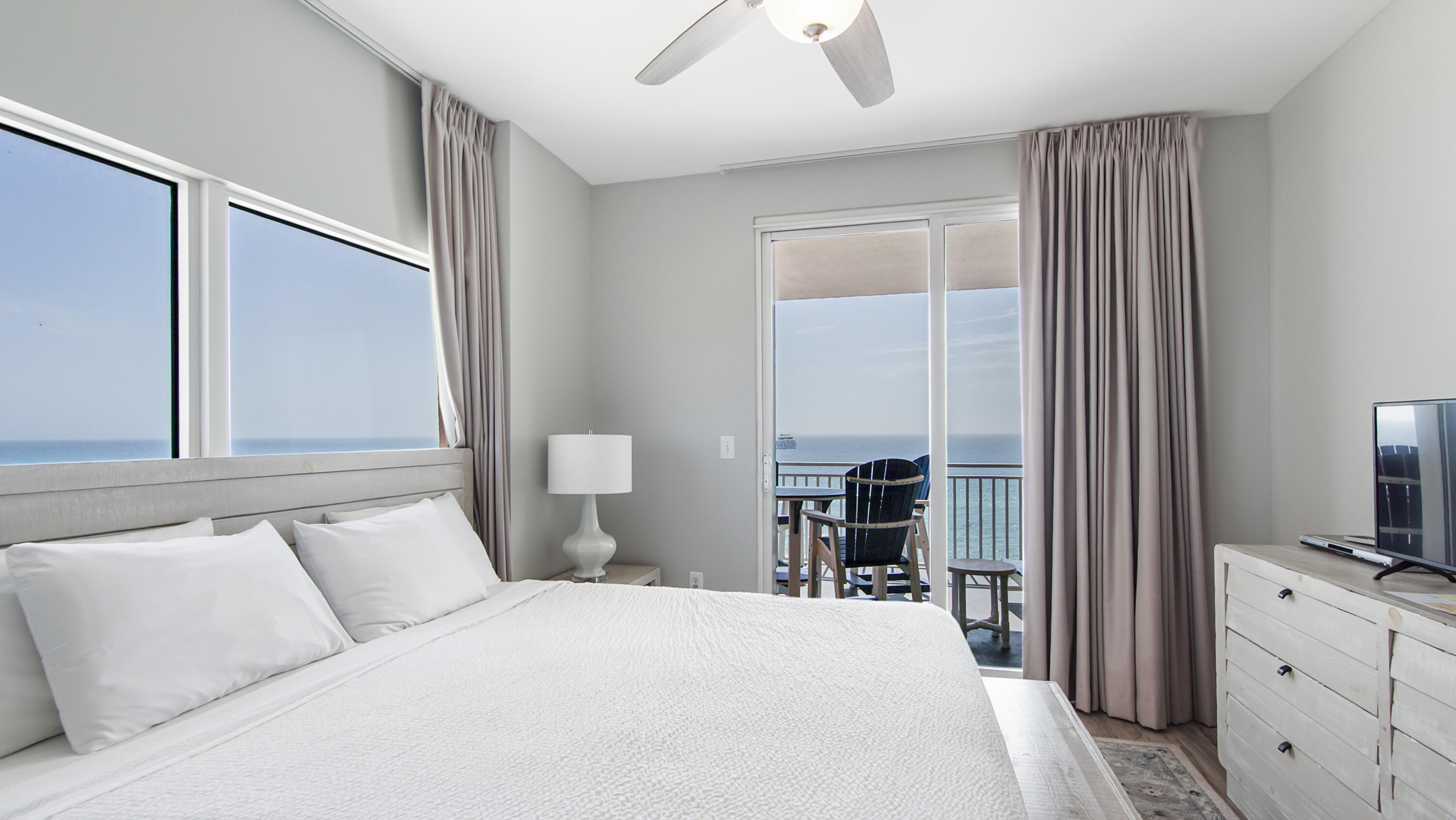 17739 Front Beach Road, Unit 507W Panama City Beach, FL 32413 - Photo 20 of 49 a bedroom with a bed and a flat tv screen on dresser