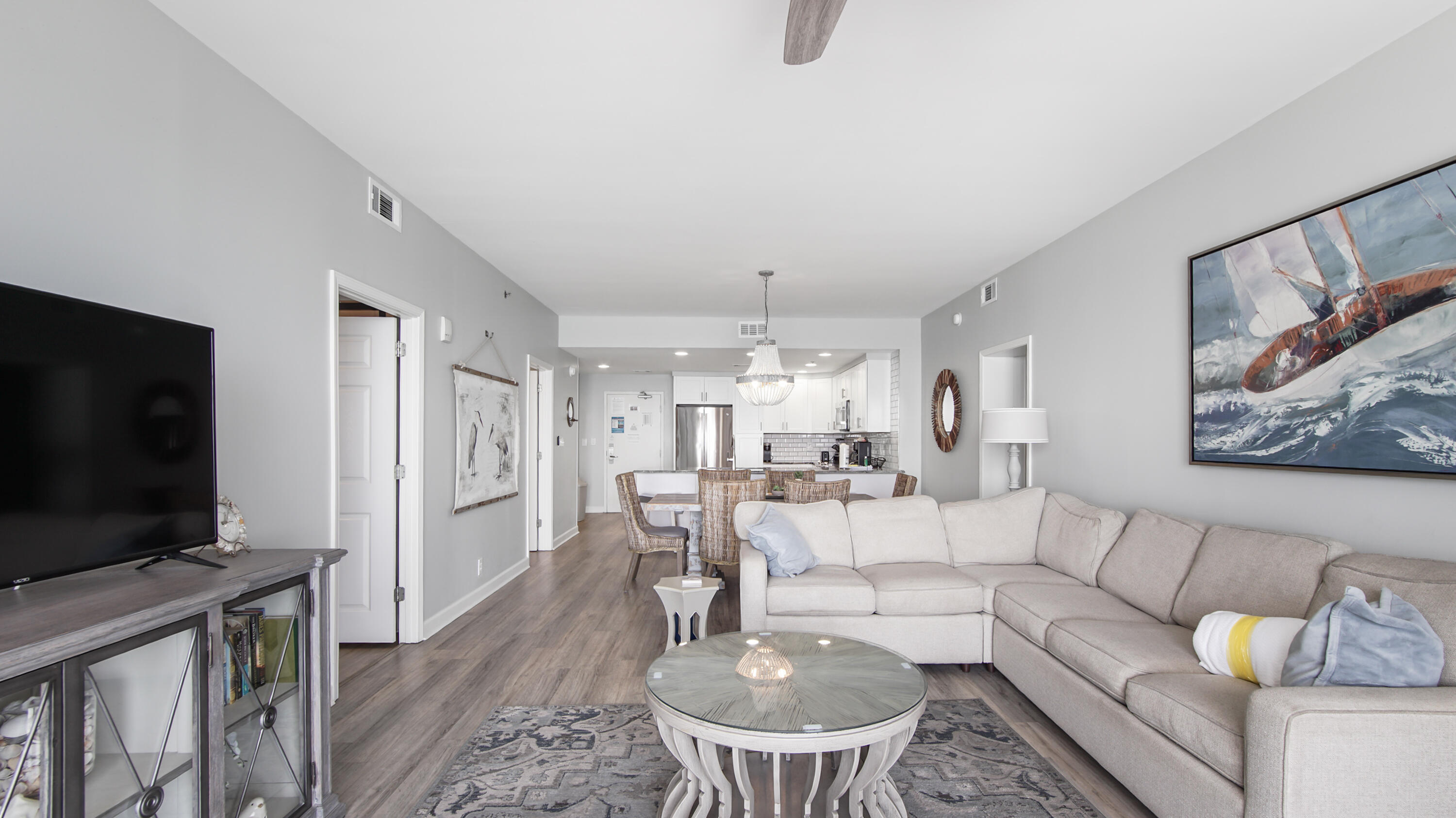17739 Front Beach Road, Unit 507W Panama City Beach, FL 32413 - Photo 27 of 49 a living room with furniture and a flat screen tv