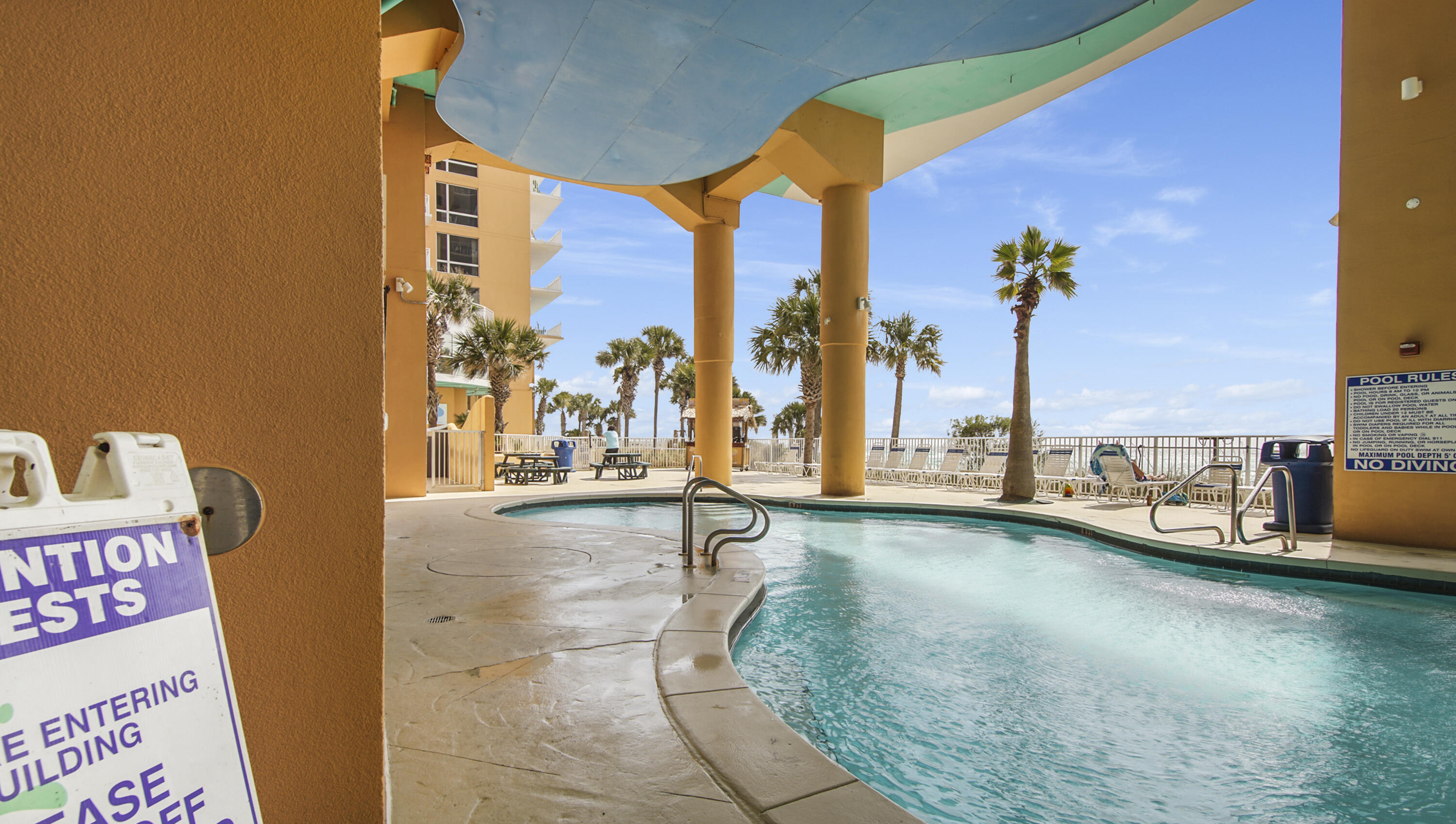 17739 Front Beach Road, Unit 507W Panama City Beach, FL 32413 - Photo 48 of 49 swimming pool with outdoor seating