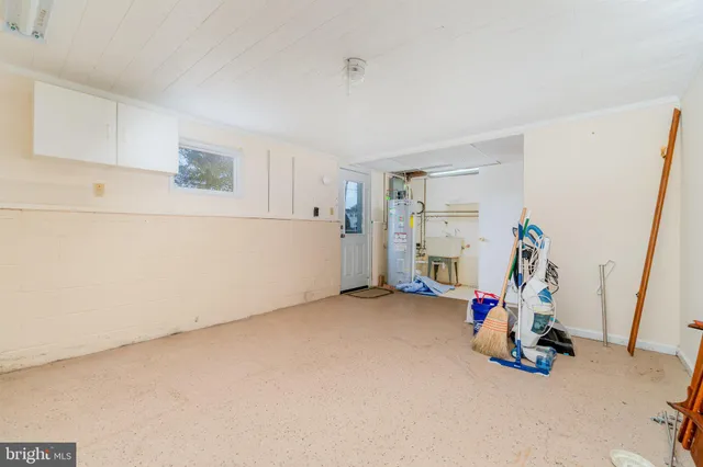 a view of storage and utility room with closet